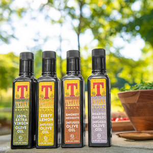 Image of Texan Brands infused olive oil bottle sitting on table outside.
